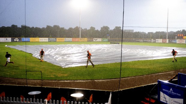The covers were out at Narrabundah Ballpark on Thursday night as the deluge washed out the match between the Canberra Cavalry and the Sydney Blue Sox.