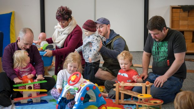 Brett Eagleton and his daughter, Katie, at the Edithvale fathers' group, with maternal and child health nurse Fleur De Zilva, and dads Shaun Scarr and Ben Hughes.