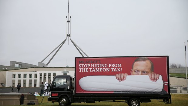 A truck and giant dancing tampons protesting against tax on sanitary products on the front lawn of Parliament House in Canberra on Thursday.