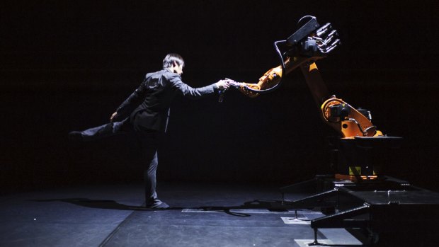 Huang Yi, dancer and choreographer from Taiwan, dancing with Kuka the robot.