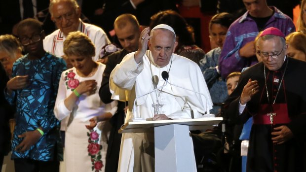 Pope Francis makes the sign of the cross during the closing ceremony for the World Meeting of Families, a Vatican-sponsored conference in Philadelphia.