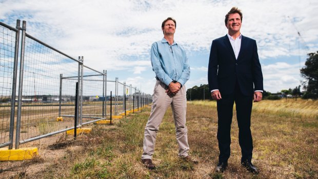 Foy's Bevan Dooley and Stuart Clark at the site of the proposed plastics-to-fuel factory in Hume. Findings from an expert health panel are due within weeks.