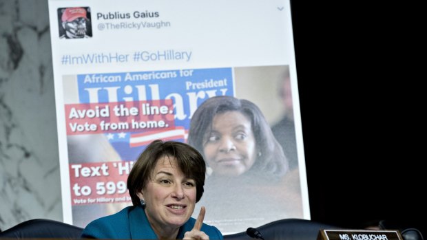 Senator Amy Klobuchar, a Democrat from Minnesota, questions witnesses in front of a social media post on Tuesday.