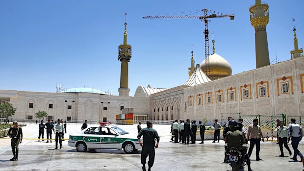 Police officers gather at the shrine of late Iranian revolutionary founder Ayatollah Khomeini in Tehran, after an assault by several attackers.