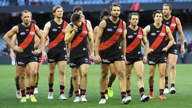 The Bombers make their way from the ground after losing to the Lions.