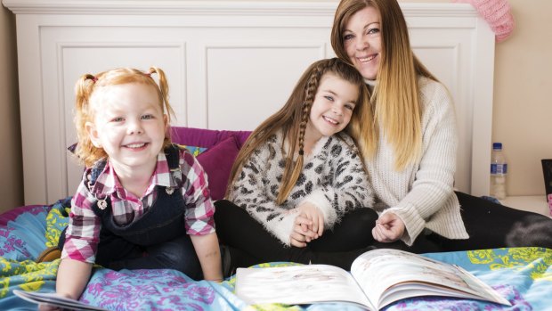 Seven years old Izabella Smith, with her mum Bronwyn and three-year-old little sister Harlow.