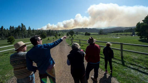 Locals watch the out-of-control Lancefield fire on Wednesday.