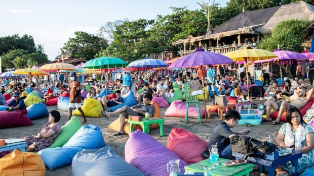 Tourists at a beach club in Seminyak, Bali after Indonesia reopened borders last month.