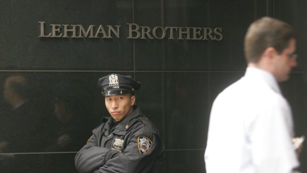 A police officer stands outside the headquarters of Lehman Brothers in Times Square on March 18, 2008 in New York City.