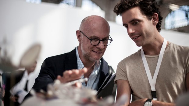 Swatch creative director Carlo Giordanetti (left) explains his design to singer Mika.