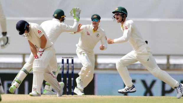 Dismissed: England captain Joe Root, left, after being caught by Australia's Steve Smith on day four at the WACA.