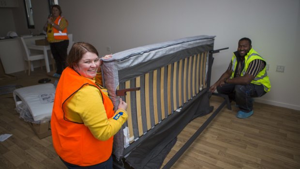 Ikea's customer support manager Leanne Wilding and recovery manager Saif Islam prepare furniture for the Common Ground public housing facility.