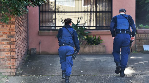 NSW Police officers at the family home of Justine Damond on Sydney's northern beaches on Monday.