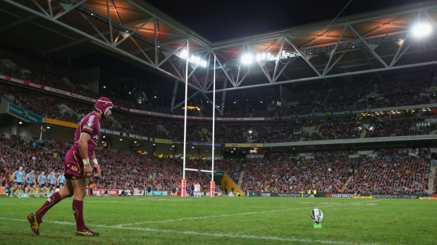 The Origin spectacle ... fans watch Johnathan Thurston takes a kick at goal during a 2013 Origin match at Suncorp Stadium.