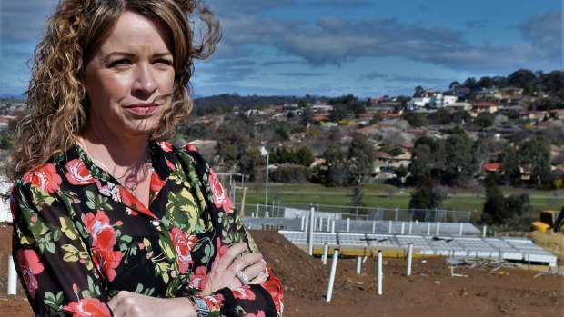 Kerrianne Abbott at the site of her new home in the Canberra suburb of Moncrieff. Ms Abbott said the delay between her purchase of the block more than a year ago and final permission to build was unacceptable.