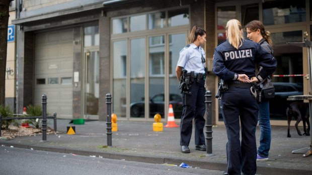 Police stand at the scene of an incident in the German city of Cologne on August 15.