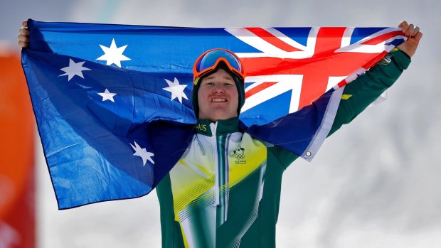 Australia's Jarryd Hughes celebrates his silver medal after the men's snowboard cross final.