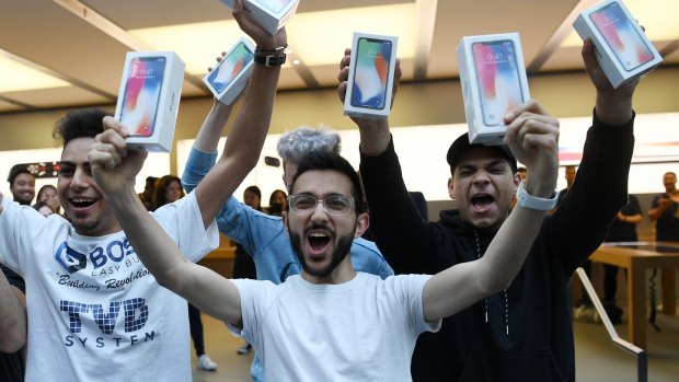 Mazen Kourouche, centre, was among the first to get the iPhone X at the Apple Store in Sydney in November.