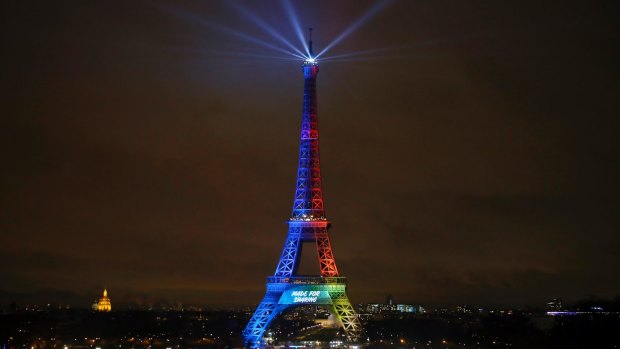 Eiffel Tower is lit with colors for the Paris 2024 campaign in February. 