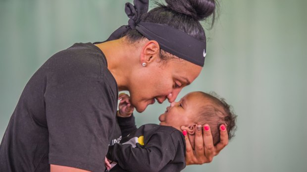 Canberra Capitals recruit Mistie Bass with son Braven Boyd. 
