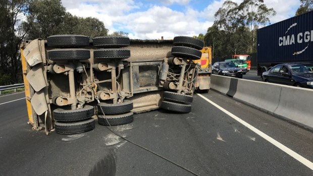 A flipped truck trailer blocking two of the city bound lanes on the M5.