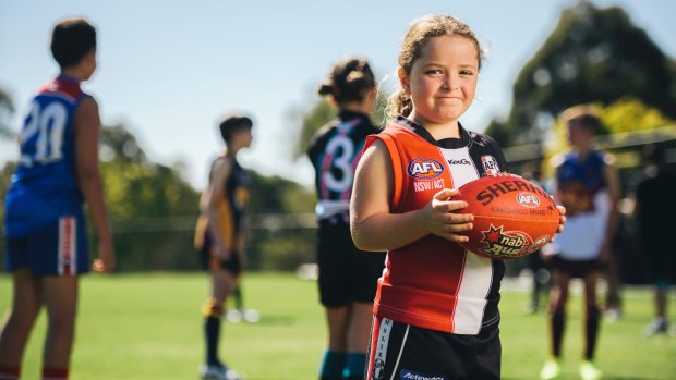 Ainslie player Elise Doherty, 7, is part of a booming footy resurgence.