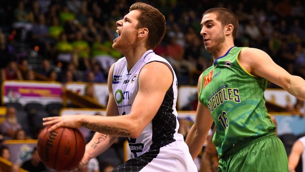 Igor Hadziomerovic of Melbourne United is fouled by Mirko Djeric of Townsville during Thursday's match.