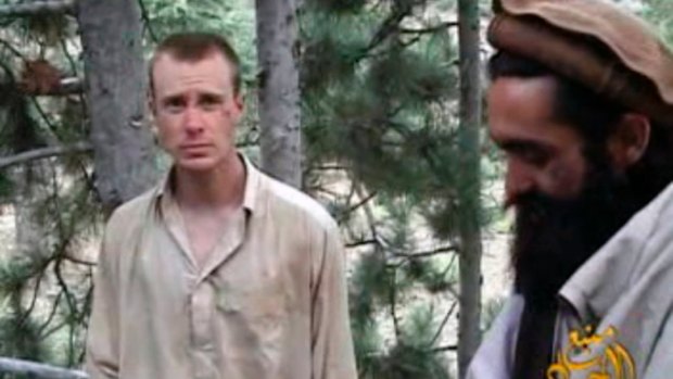 A frame grab from a 2010 video released by the Taliban showing Bergdahl with one of his Afghan captors.