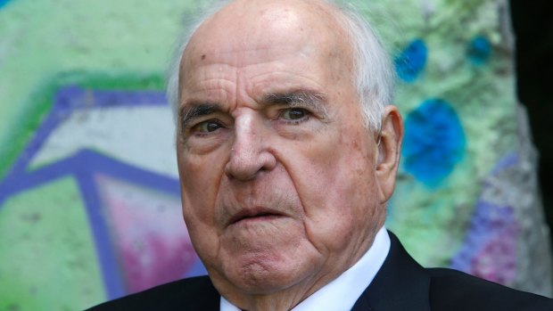 Former German Chancellor Helmut Kohl in front of a piece of the Berlin Wall in Kohl's garden near Ludwigshafen, 2014.