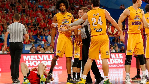 Big hit: Josh Childress is restrained after fouling Jesse Wagstaff of the Perth Wildcats' off the ball at Perth Arena.