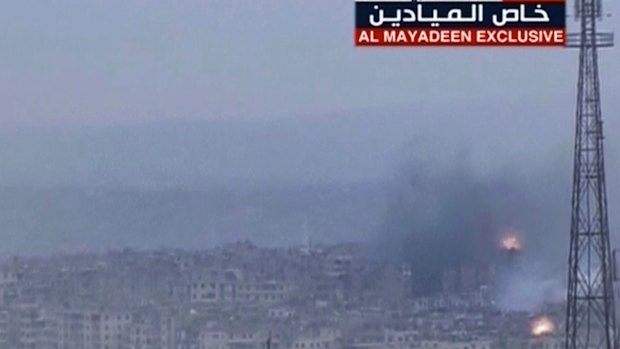 Plumes of smoke followed explosions in east Aleppo on Wednesday. 