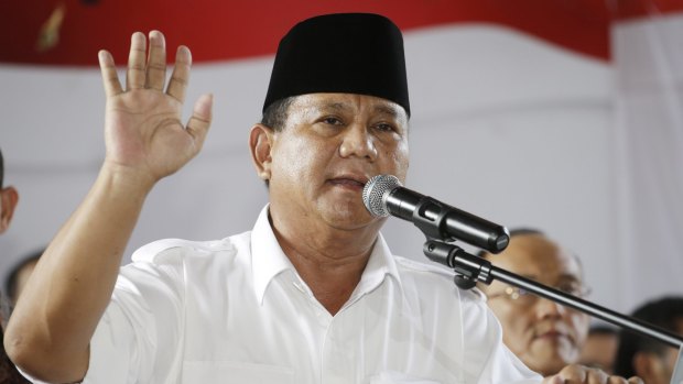 Indonesian presidential candidate Prabowo Subianto gestures during a press conference in Jakarta, Indonesia.