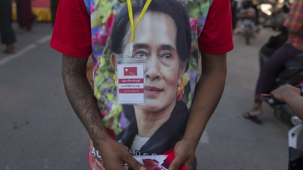 A supporter of Myanmar's opposition leader Aung San Suu Kyi's National League for Democracy party on Tuesday. 