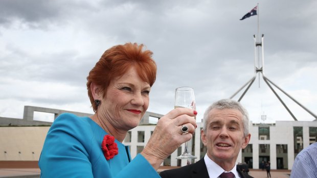 Senators Pauline Hanson and Malcolm Roberts celebrate Donald Trump's success on Wednesday.