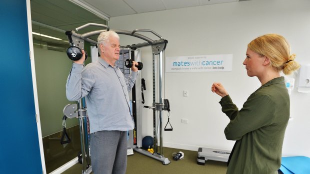 John Allison working with weights.