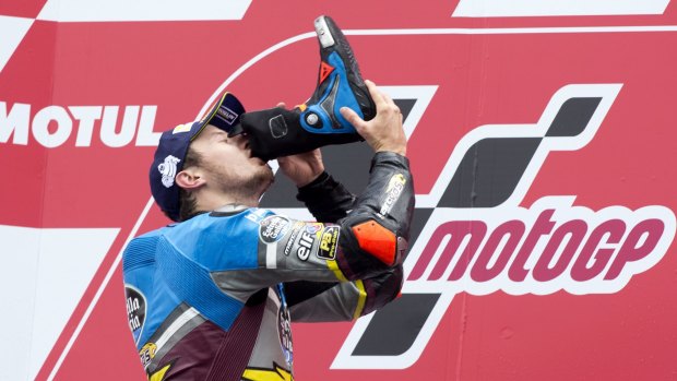 Unusual: MotoGP rider Jack Miller celebrates his victory by drinking from his boot.
