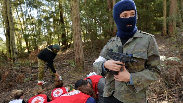 Under threat. A team of Red Cross aid workers are "captured" at a hostile environment training camp in Yellingbo, east of Melbourne.