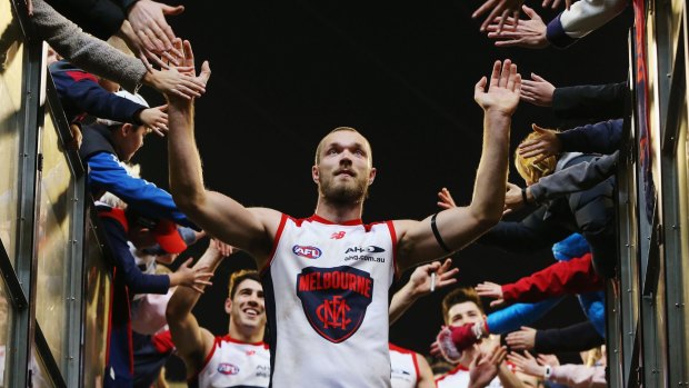 Tapping out: Max Gawn celebrates with fans at the MCG.