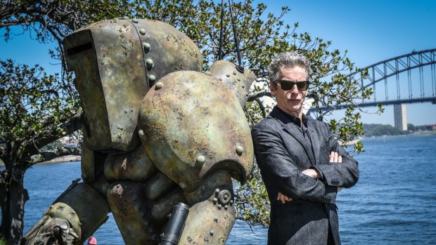 <i>Doctor Who</i> star Peter Capaldi and a mire, a monster from season 9, on Friday. 