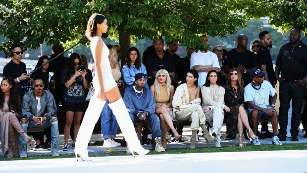 Tyga, Kylie and Kendall Jenner, Kim Kardashian, Carine Roitfeld and Pharrell Williams front row at Yeezy last week.
