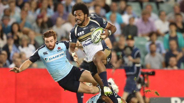 Speed bump: The Waratahs stumble over themselves trying to stop Henry Speight.
