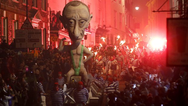 Remember, remember, the fifth of November: An effigy of Russian President Vladimir Putin is paraded through Lewes, England.