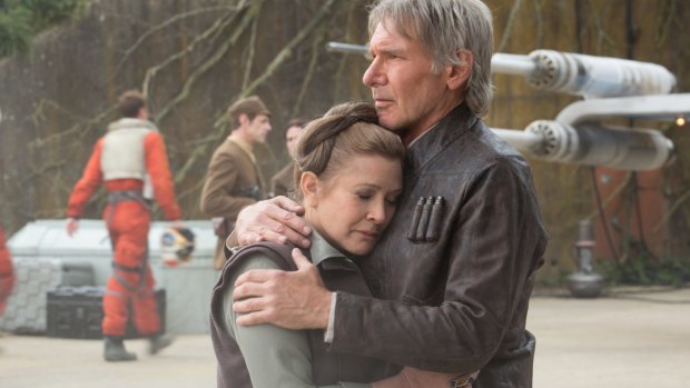 Wearing well ... Harrison Ford in THAT jacket comforts Leia (Carrie Fisher) in Star Wars: The Force Awakens.
