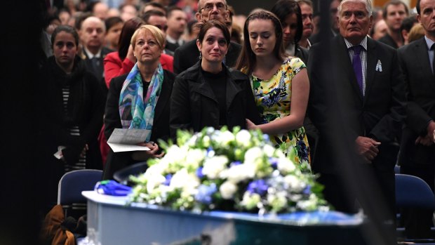 Senior Constable Brett Forte's wife Susan stands next to her daughter Emma during his funeral.