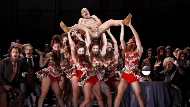 On the whole, it has not been a good day for Kovalov (Martin Winkler), here with the chorus and dancers.