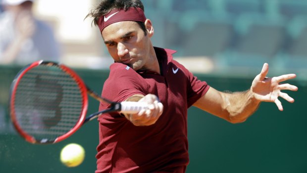 Swiss Roger Federer plays a return to France's Jo-Wilfried Tsonga.