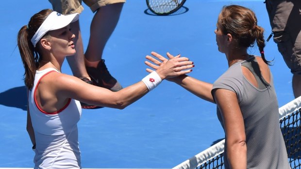 Quiet progress: Agnieszka Radwanska shakes hands with Varvara Lepchenko after their third-round match on Saturday.