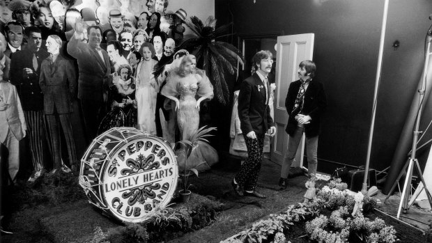Actress Diana Dors, John Lennon and Ringo Starr on the set of the shoot for the cover of the Beatles Sgt. Peppers Lonely Hearts Club. 