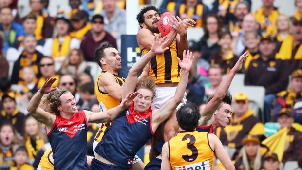 Cyril Rioli takes an exceptional pack mark for Hawthorn.