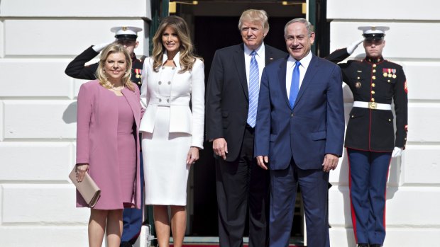 Benjamin Netanyahu, Israel's prime minister, from right, and U.S. President Donald Trump stand with their wives Melania Trump and Sara Netanyahu while arriving at the South Portico of the White House in Washington, D.C., U.S., on Wednesday, Feb. 15, 2017. 